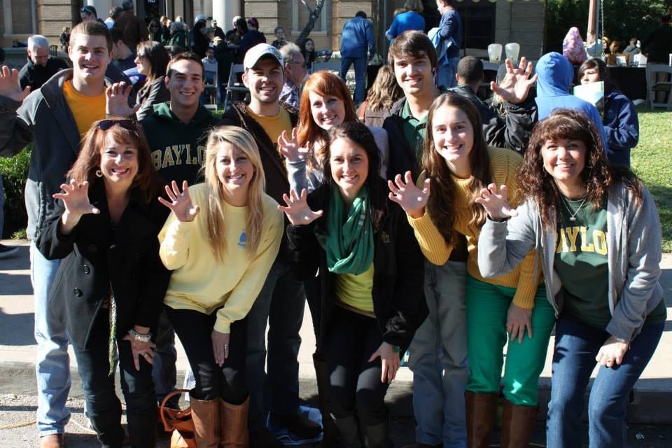 Members of the Marroquin Family -- all Baylor alums and students -- gather every year to watch the Homecoming Parade and celebrate being part of the Baylor Family.
