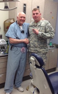 Dr. Edward Bridgeman with his final dental patient after 37 years of practice. 